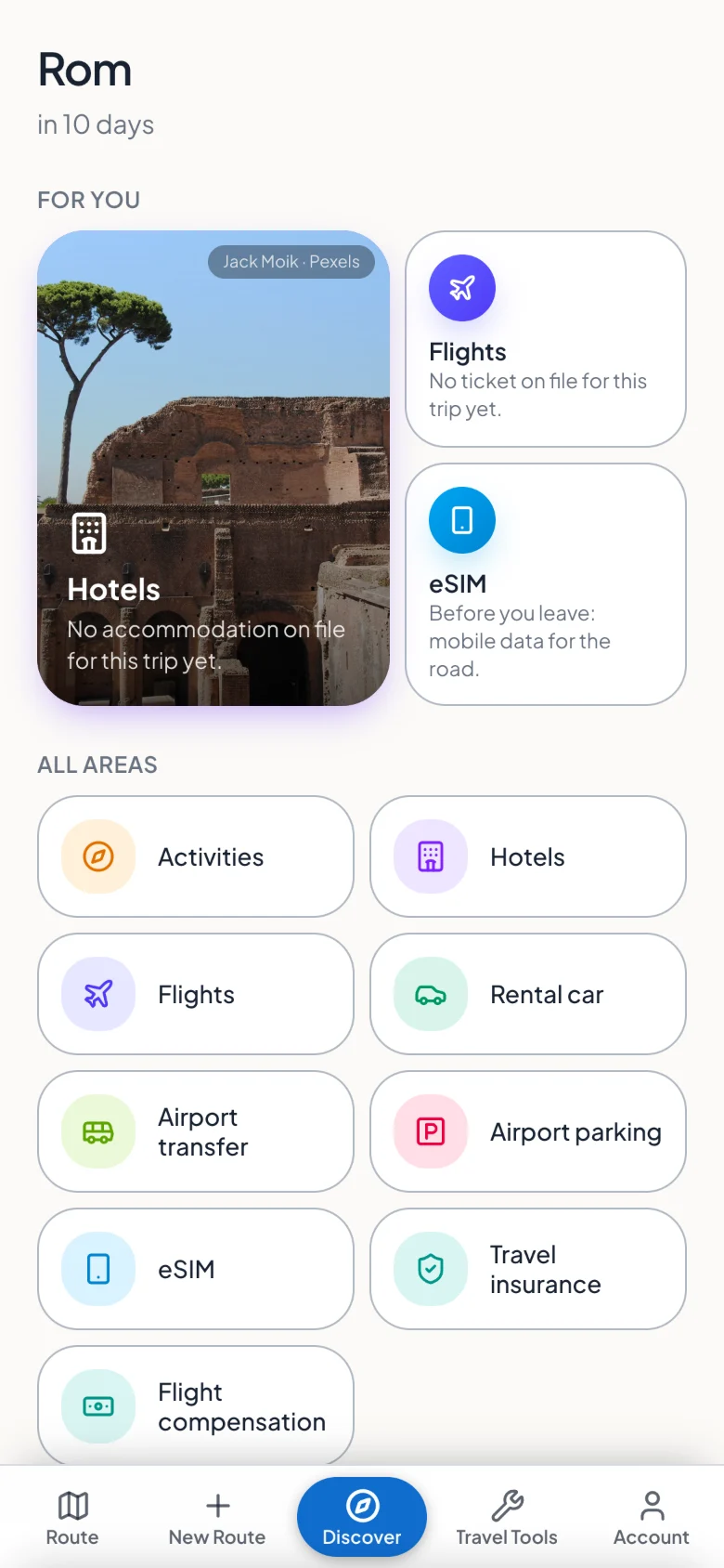 The Discover area with suggestions for hotels, flights and eSIM plus all booking categories.